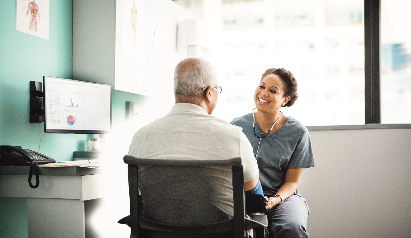 A doctor talking to a patient in medical clinic