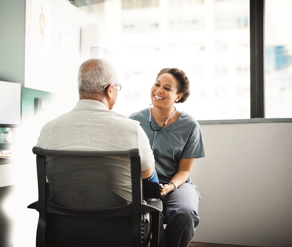 A doctor talking to a patient in medical clinic