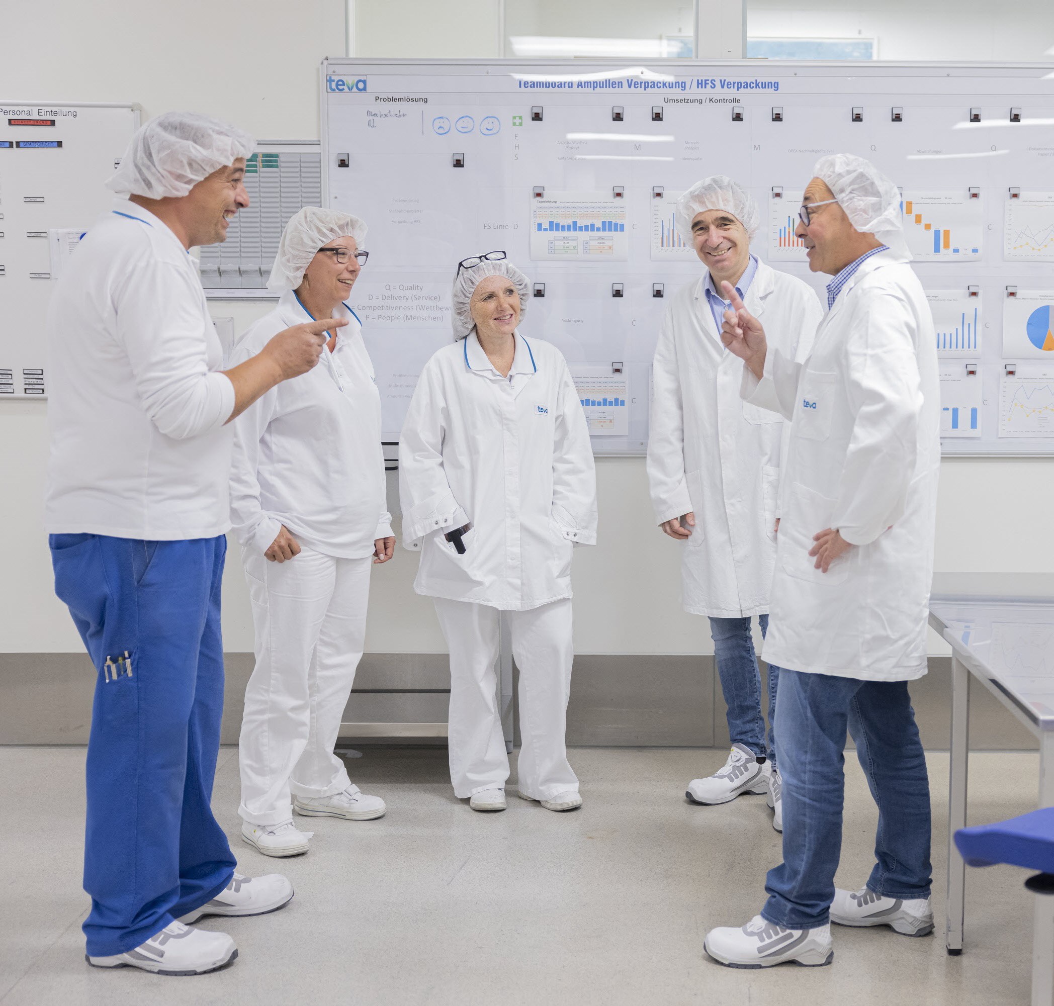 Teva employees talking in a circle