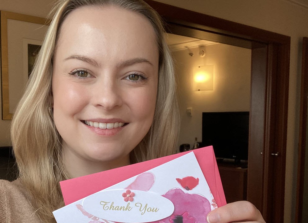 Jessica Payne holding thank you card